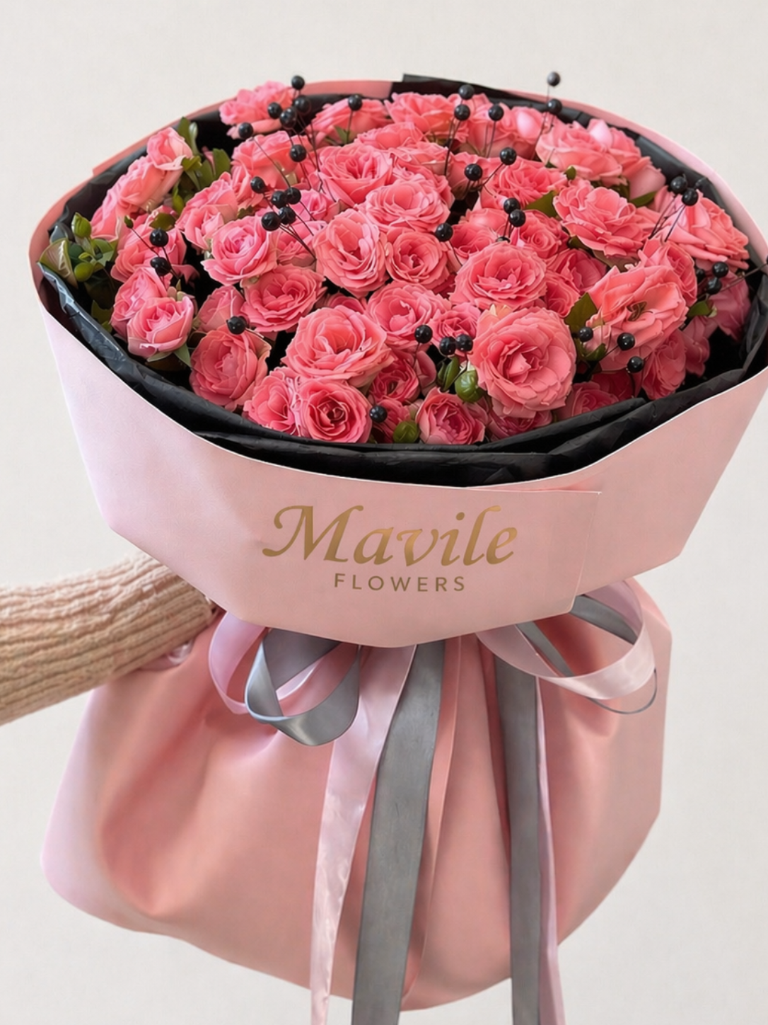 FSMIA bouquet of pink roses with decorative berries wrapped in pink floral paper