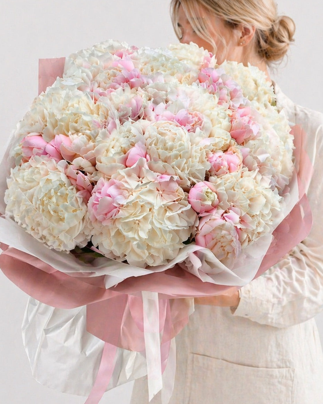 Orlando bloom fresh flower arrangement with large white and pink blooms wrapped in pink and white paper by FSMIA